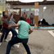 Bystanders prevent a UNRWA employee from setting himself alight, July 25, 2018.